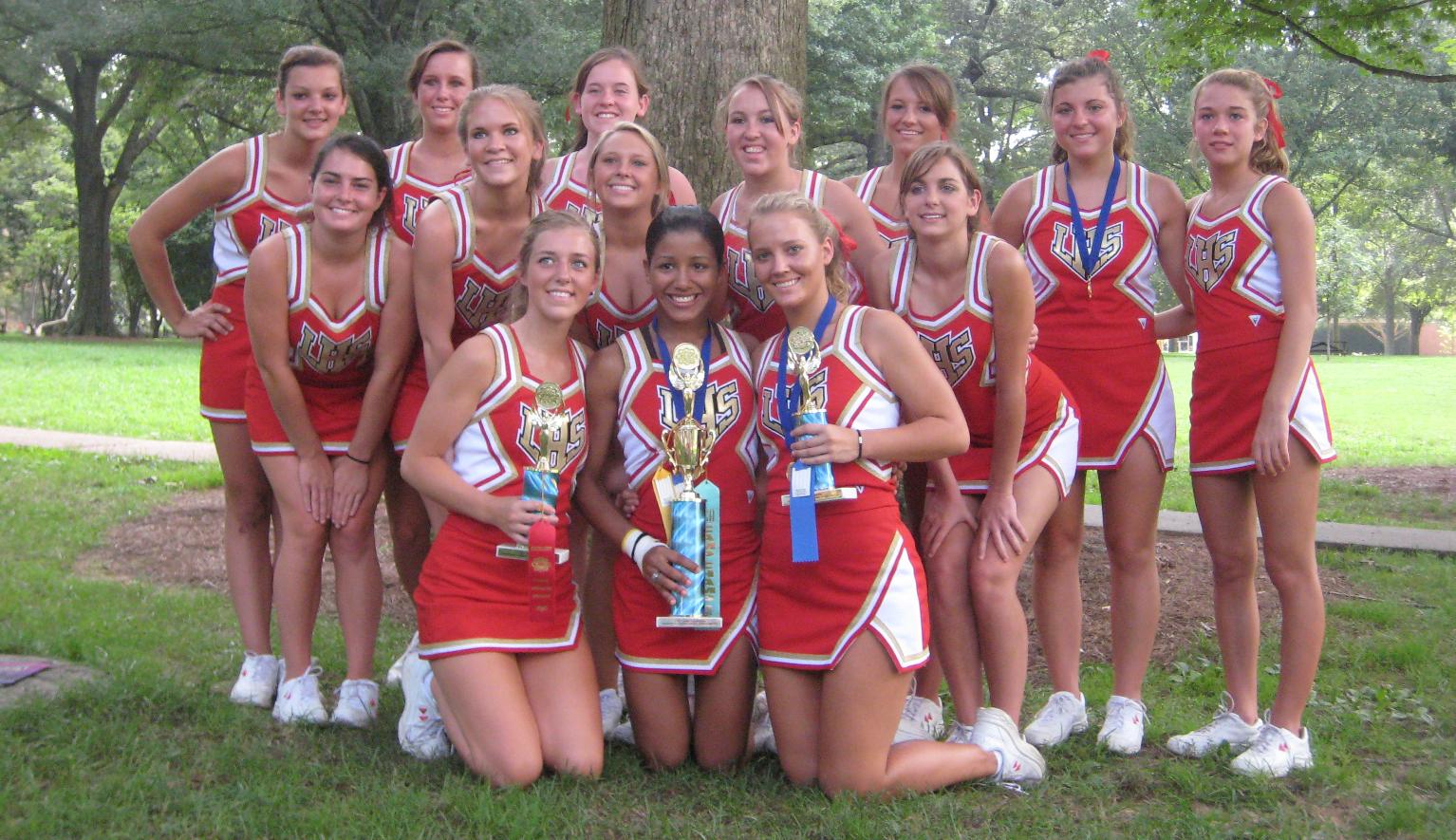 Fourteen Cheerleaders with Bare Legs wearing Short Dresses and White Sneakers